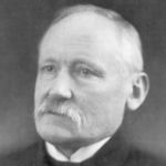 J.