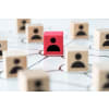 Blocks with people icons depicting a network of people