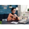 Happy woman with glasses and coffee working from home