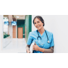 Female nurse smiling with clipboard and stethoscope