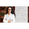 English teacher standing in front of a whiteboard.