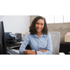 young business professional sitting at a desk in front of a computer