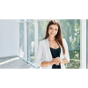 young business professional standing in an office