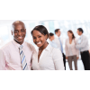 two young business professionals standing together in an office