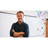 teacher standing in front of a whiteboard