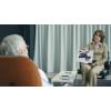 Therapist showing test materials to her patient