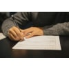 Person filling out an application form