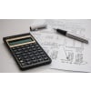 Calculator on top of printed document with data