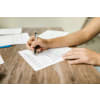 Person filling out a form