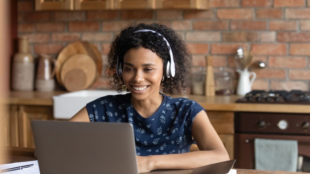 Happy student on a laptop