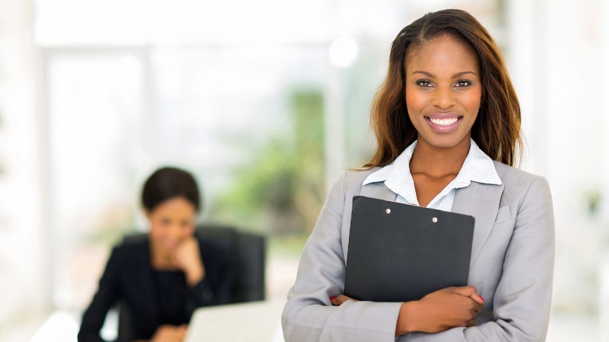 Young female professional holding a notebook