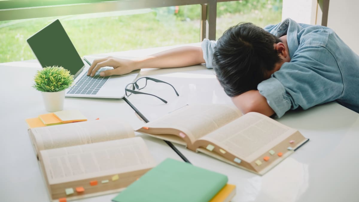 Overwhelmed male student