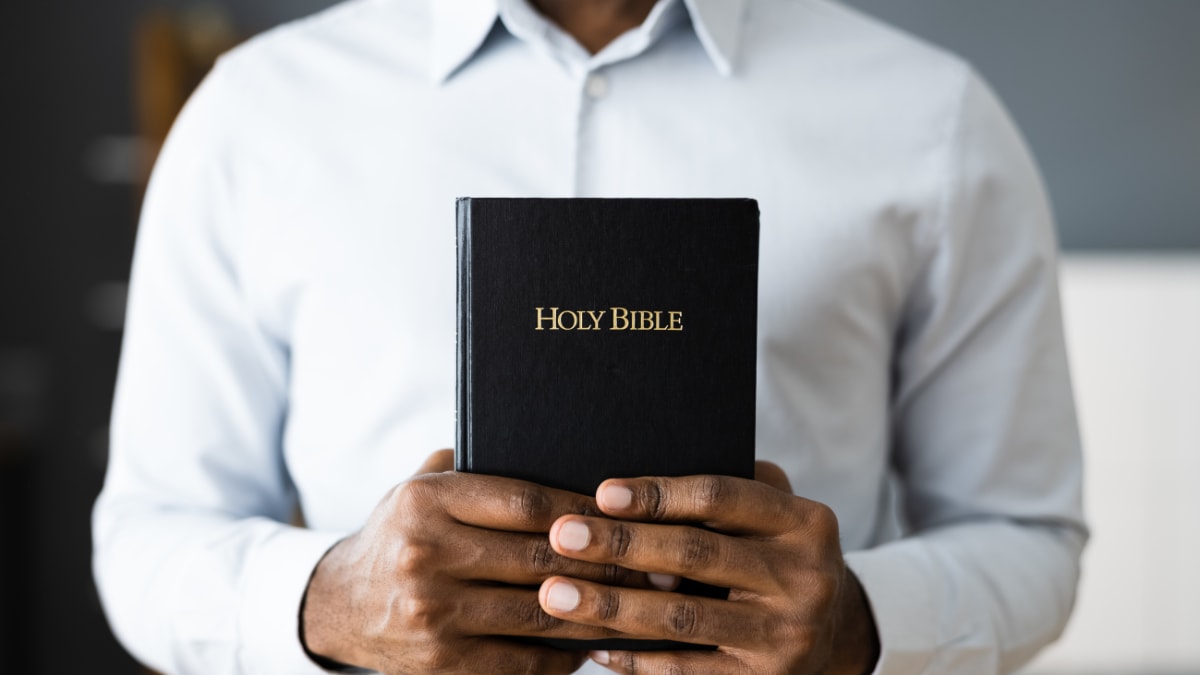 Man holding a bible