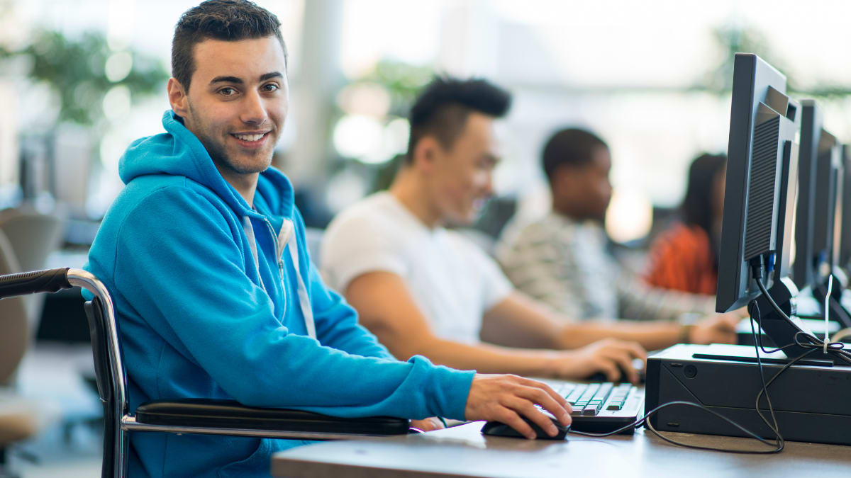 Student in wheelchair using a computer