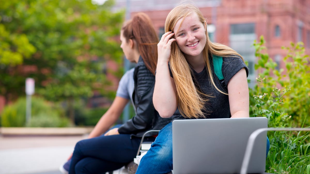 Female students studying outside