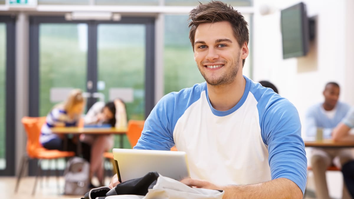 Happy man using an electronic tablet