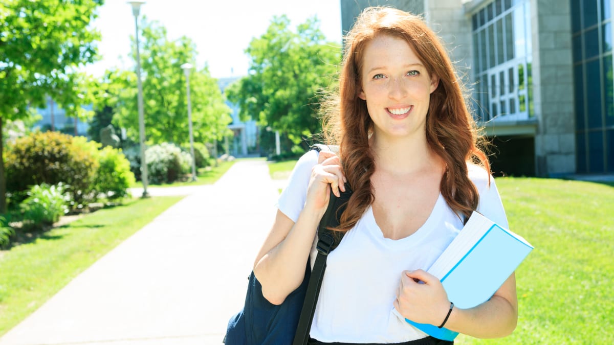 Happy female student on a college campus
