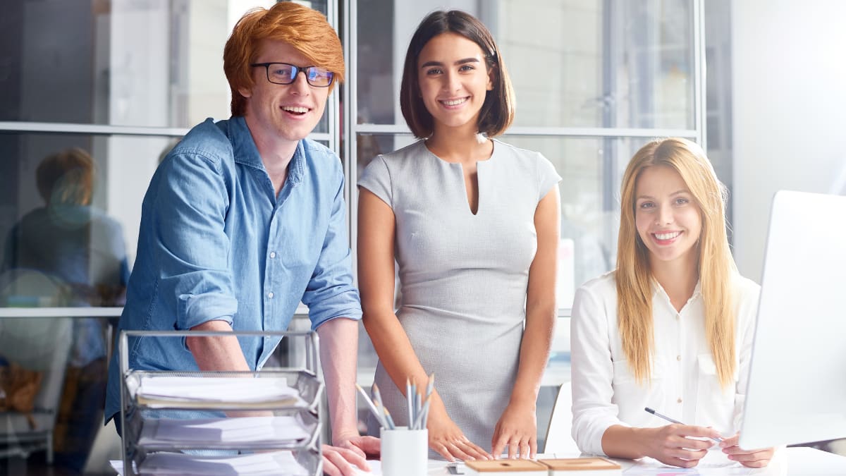 Three businesspeople at a desk