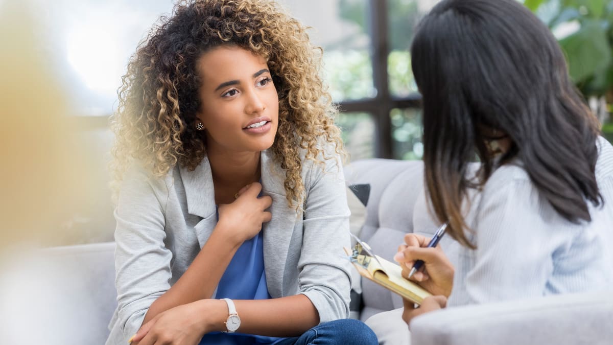 Female counselor speaking to a female patient