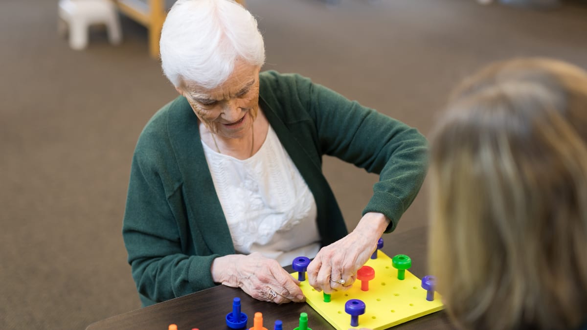 Old woman doing a hand exercise