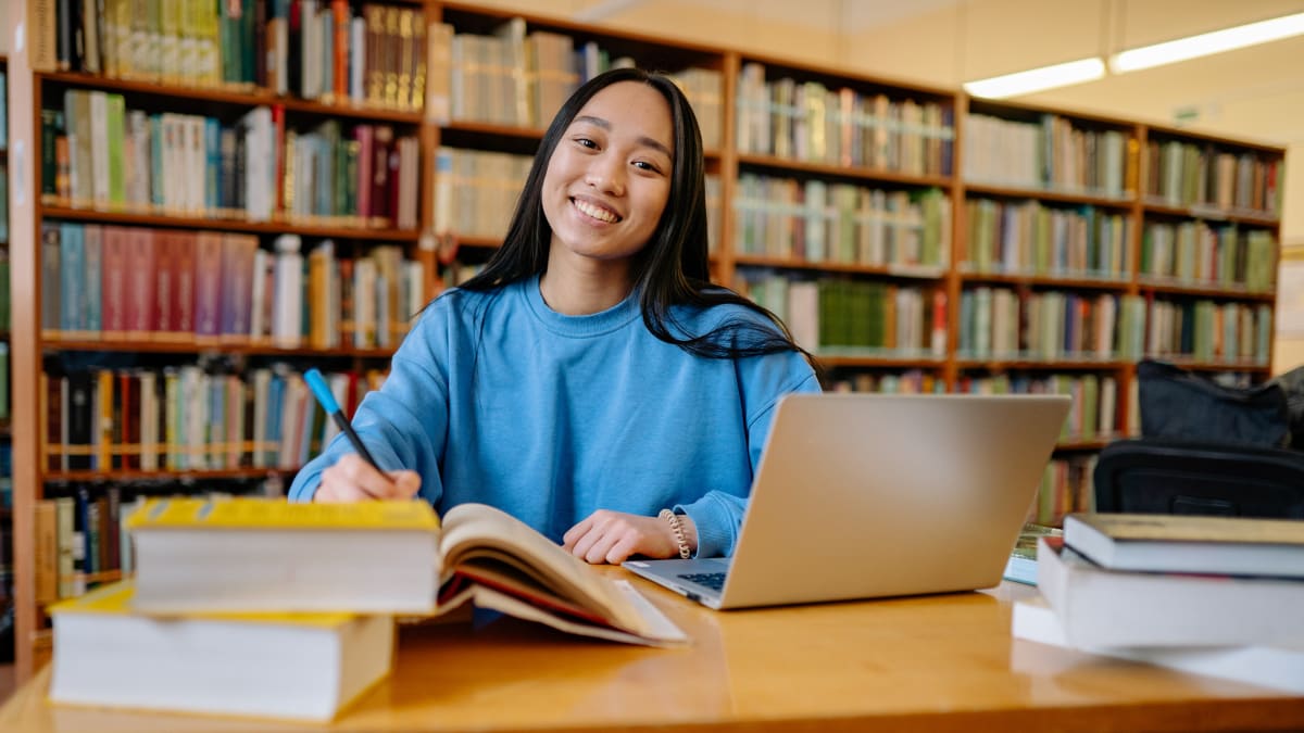 Smiling woman in a library
