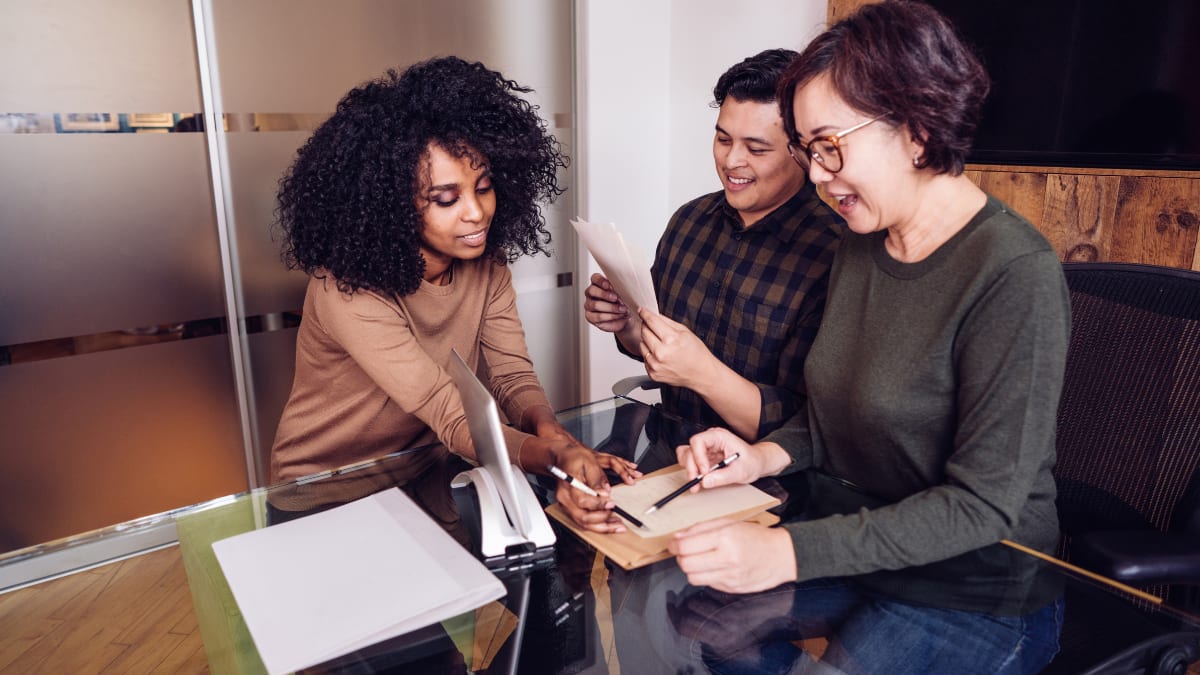 Three people having a meeting in an office