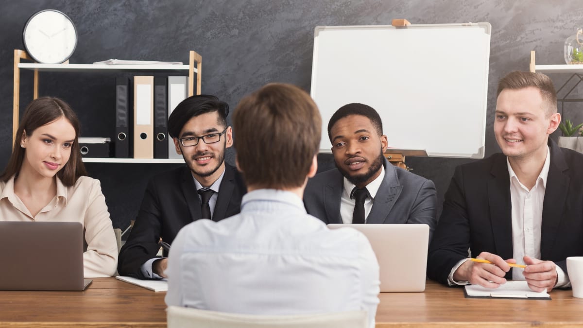 Employee talking to a group from human resources