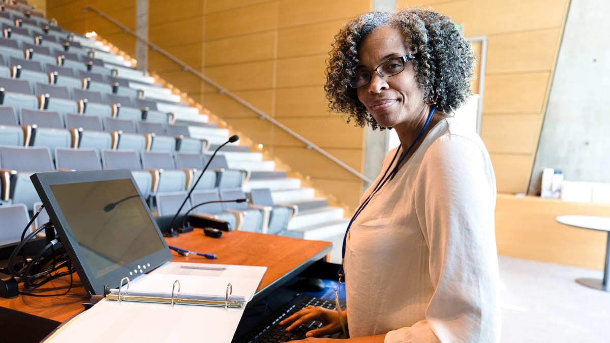 Teacher in an empty lecture hall