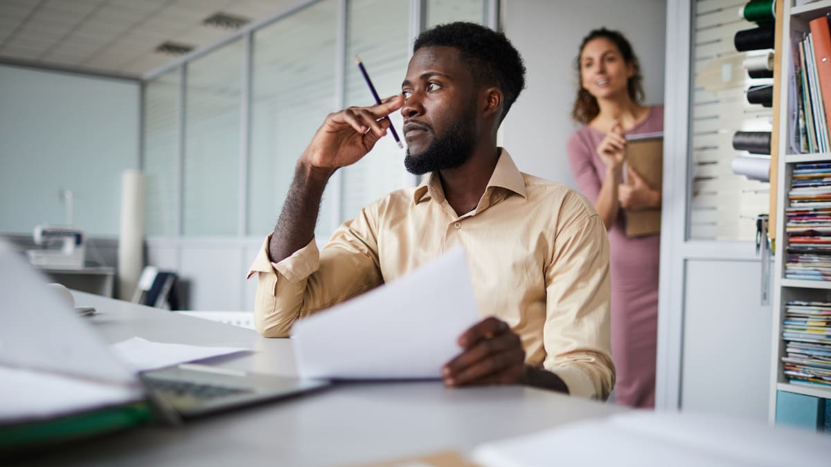 Man sitting and thinking in a meeting room