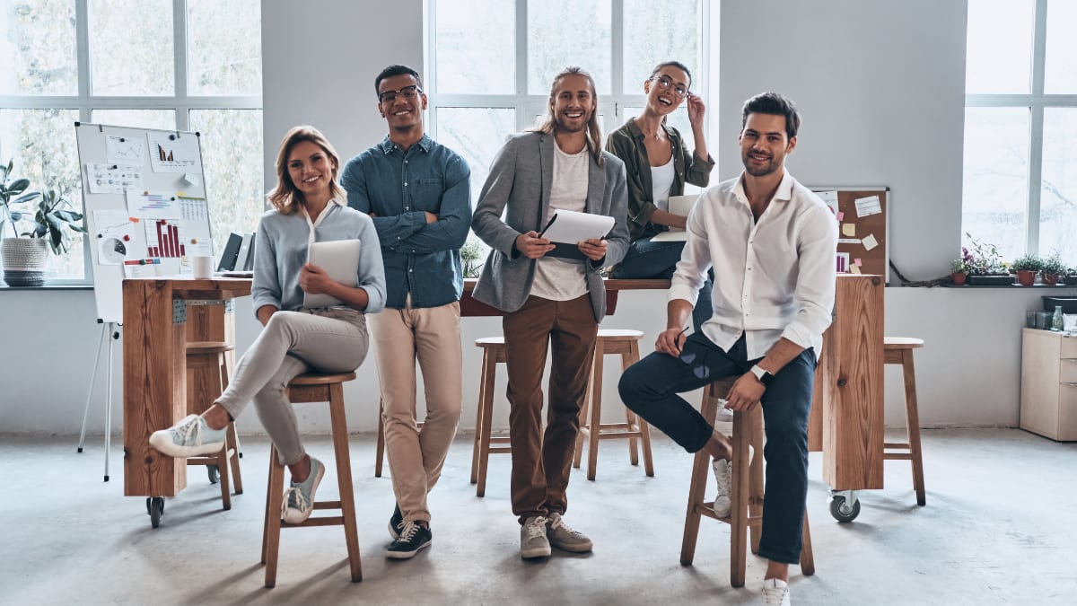 A team of young professionals smiling