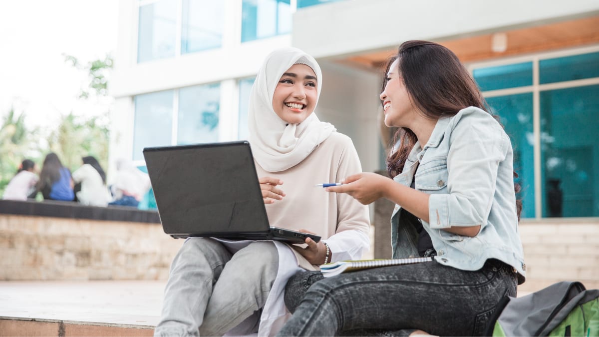 Students talking outside a college building