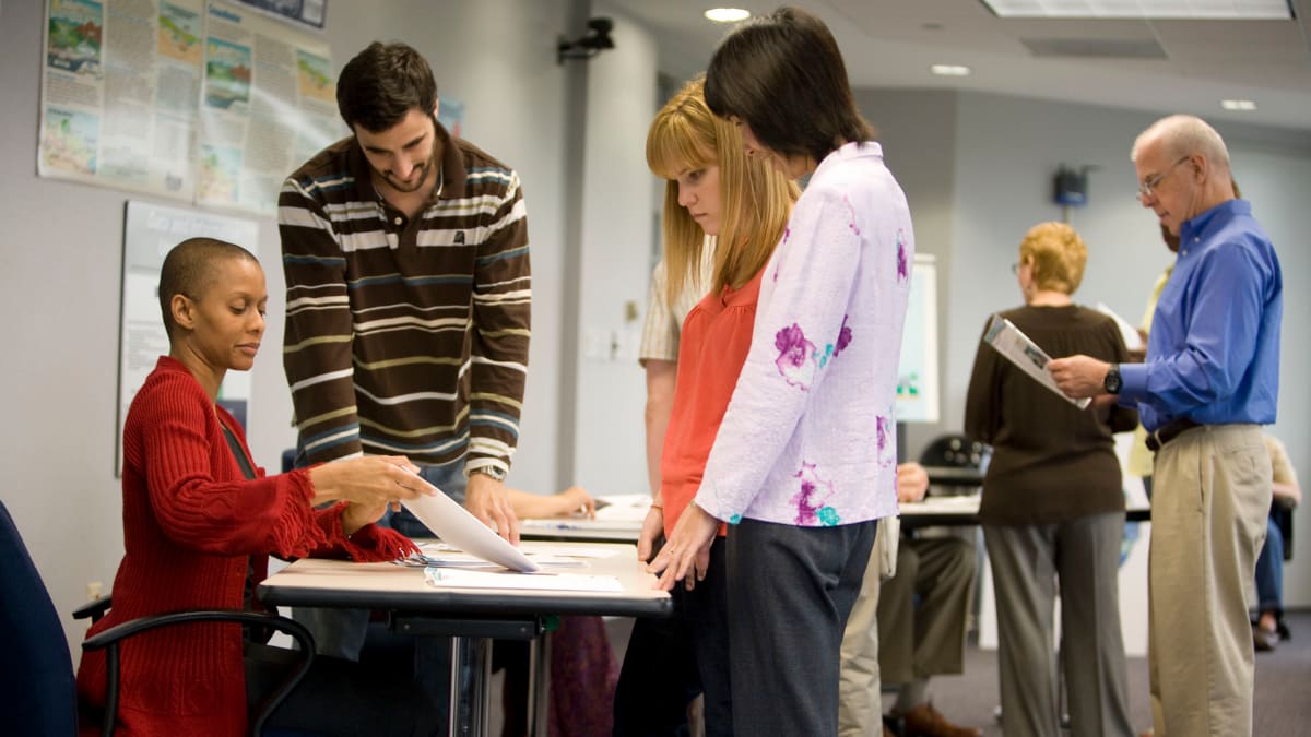Students visiting tables at a job fair