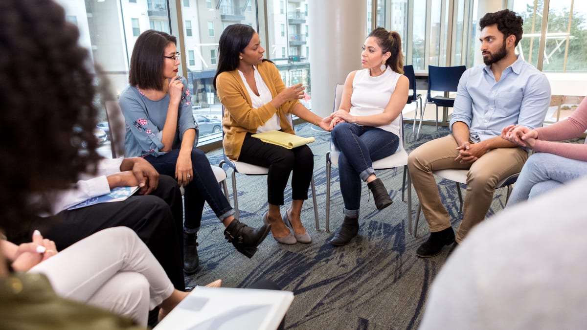 Woman counseling a group of people