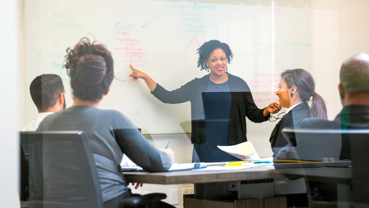 Students listening to a teacher