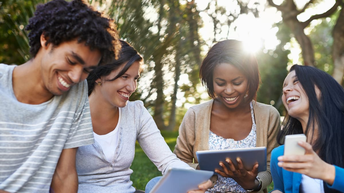 Students laughing in a park
