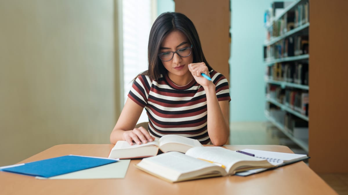 Female student studying at the library