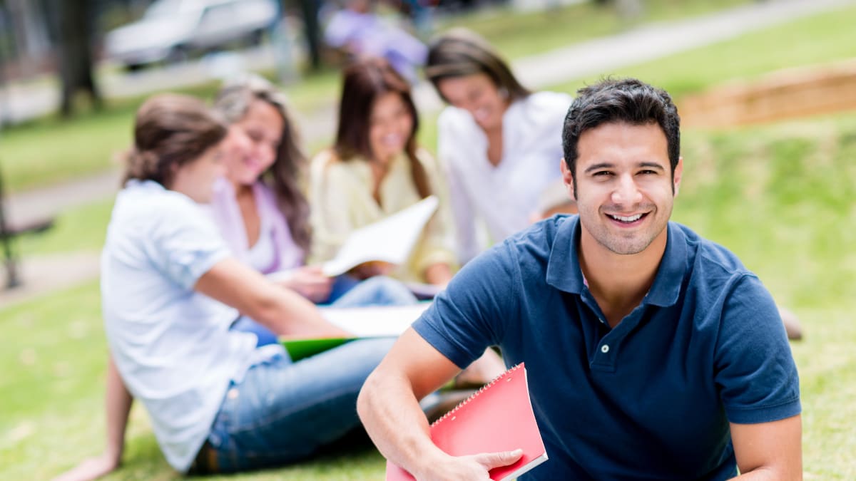 Man smiling in a park