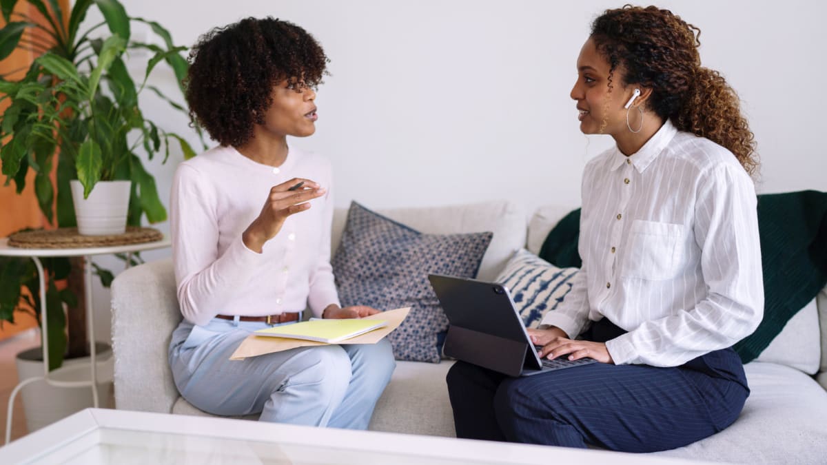 Two women discussing business