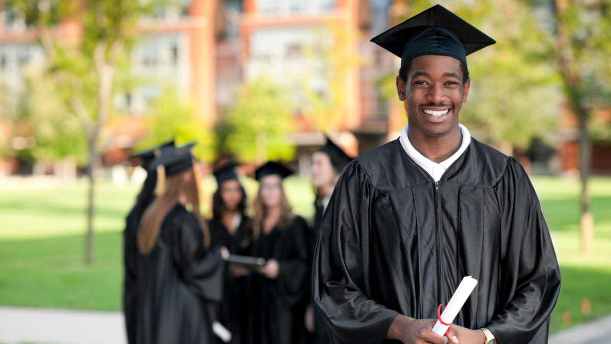 Black graduates with cap and gown