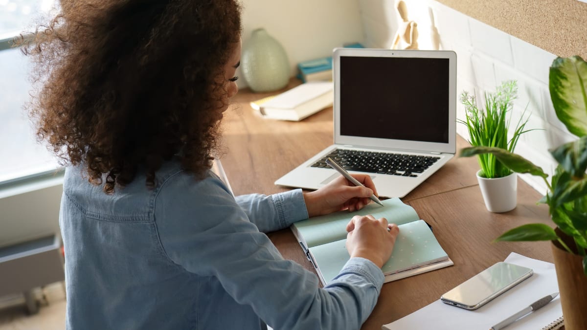 Female student studying with laptop