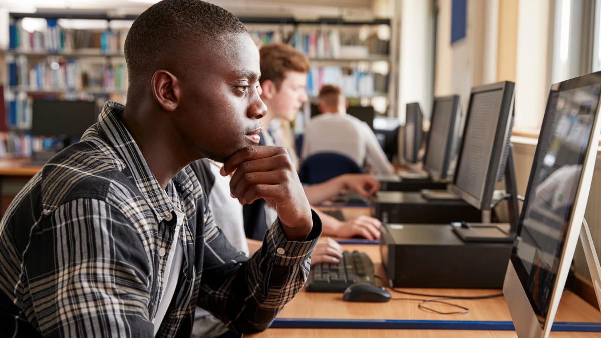 Students on computers in a library