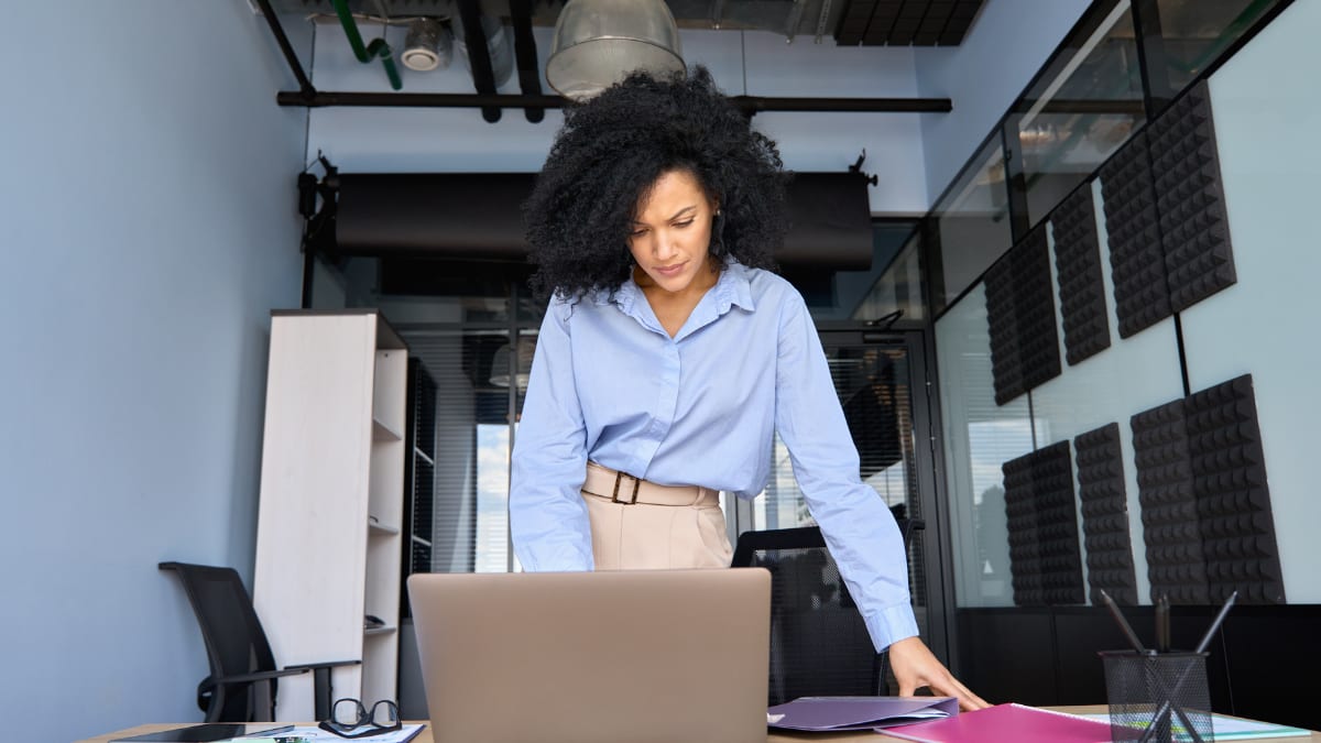 Woman working on a laptop in an office