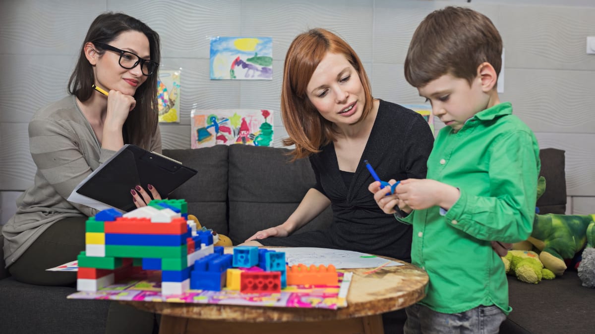 Psychologists with a child