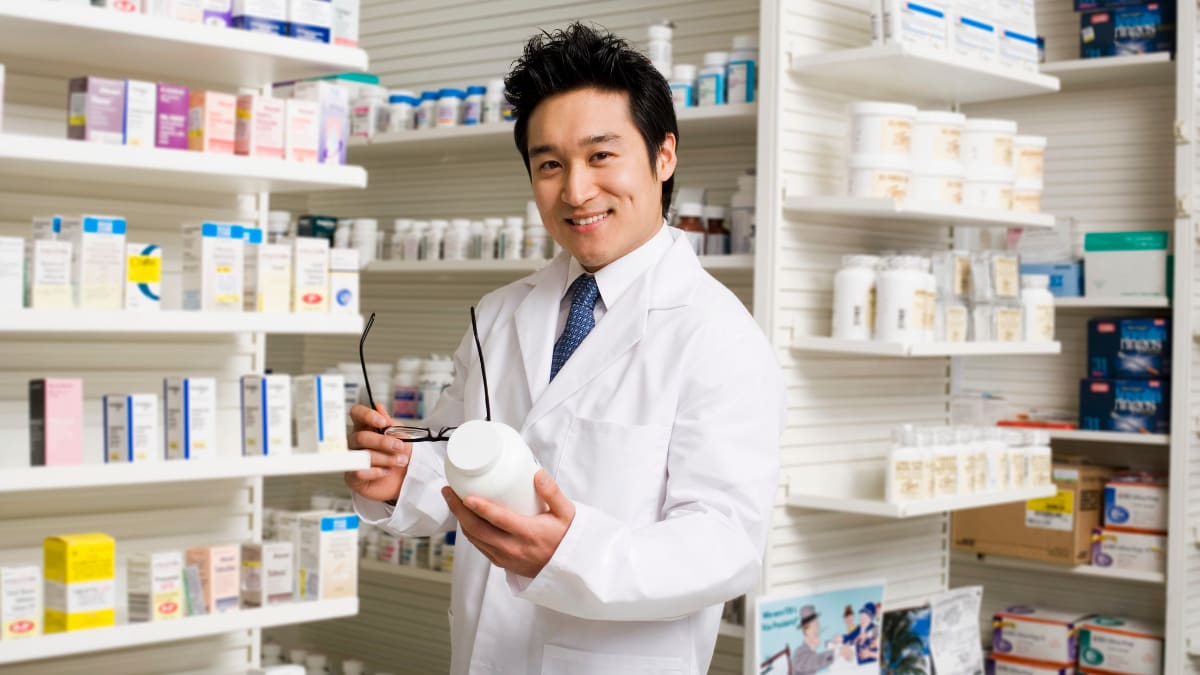 Pharmacist holding a bottle of medicine