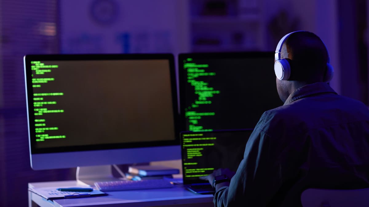 Man with headphones working in cybersecurity