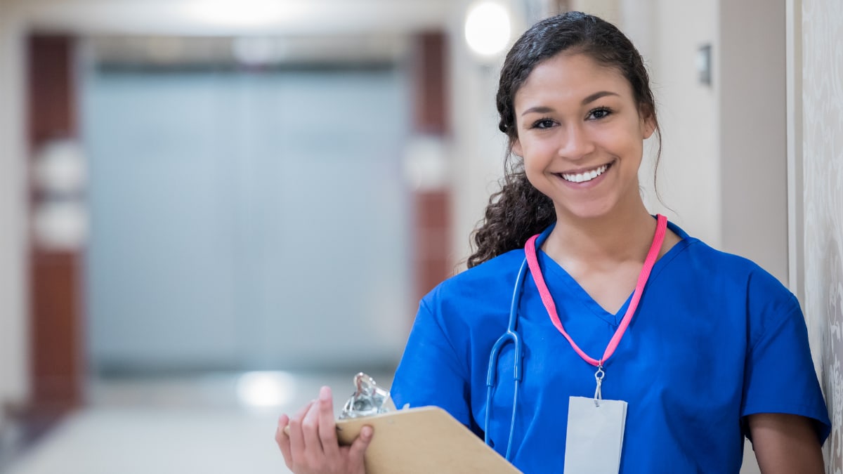 Smiling nurse with a clipboard