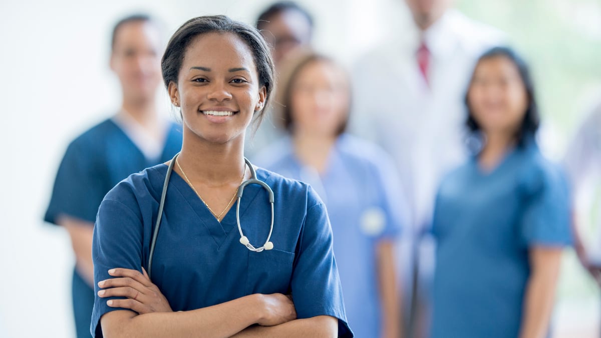 Female nurse with folding arms