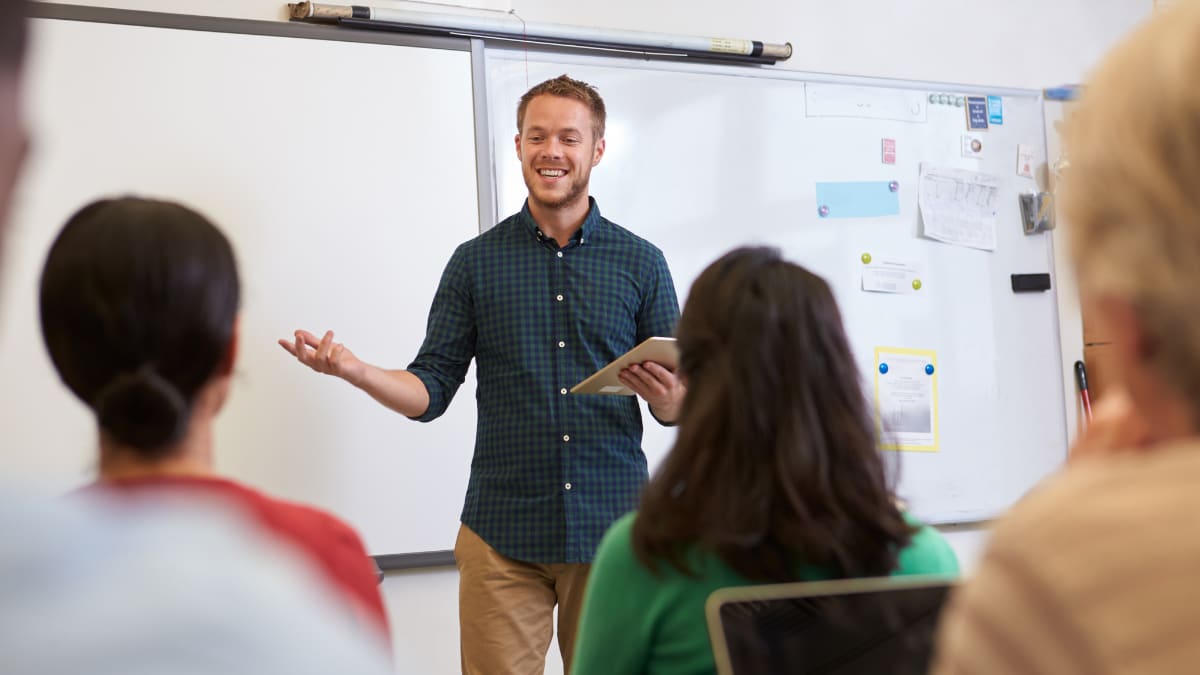 Teacher smiling at students