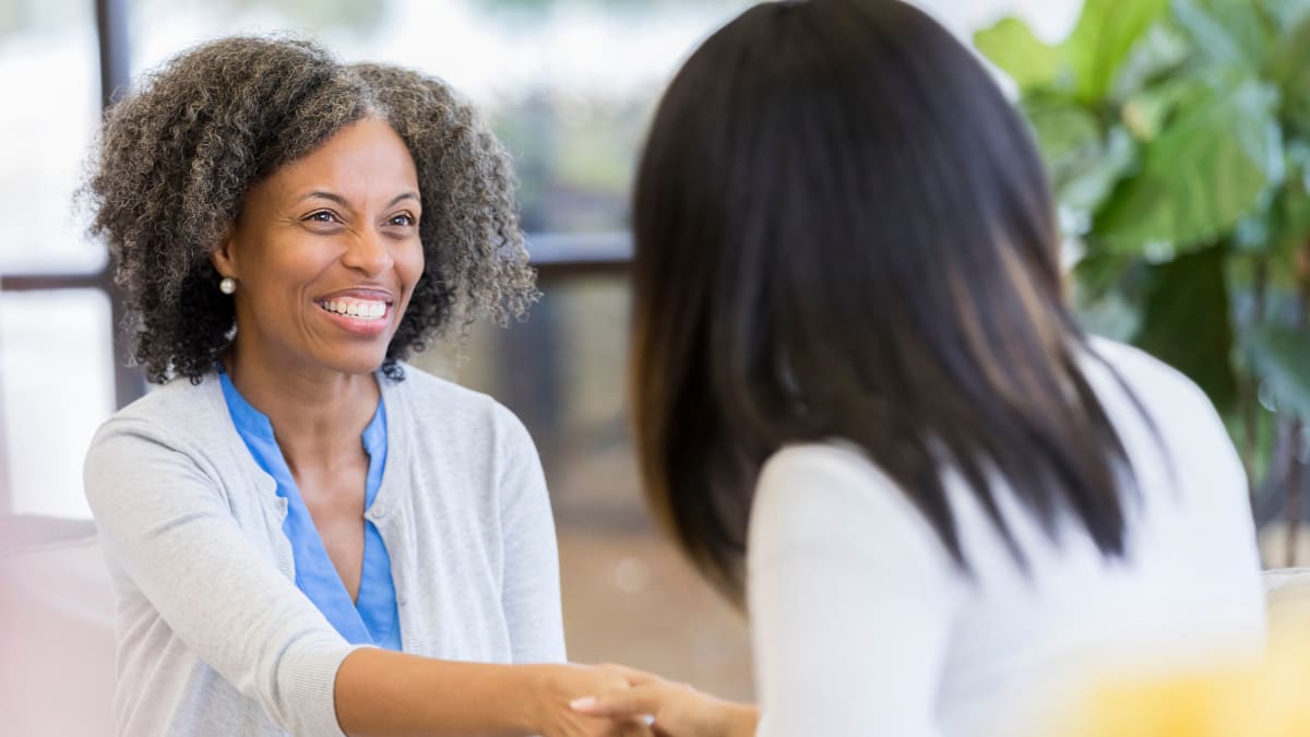 Counselor working with old woman