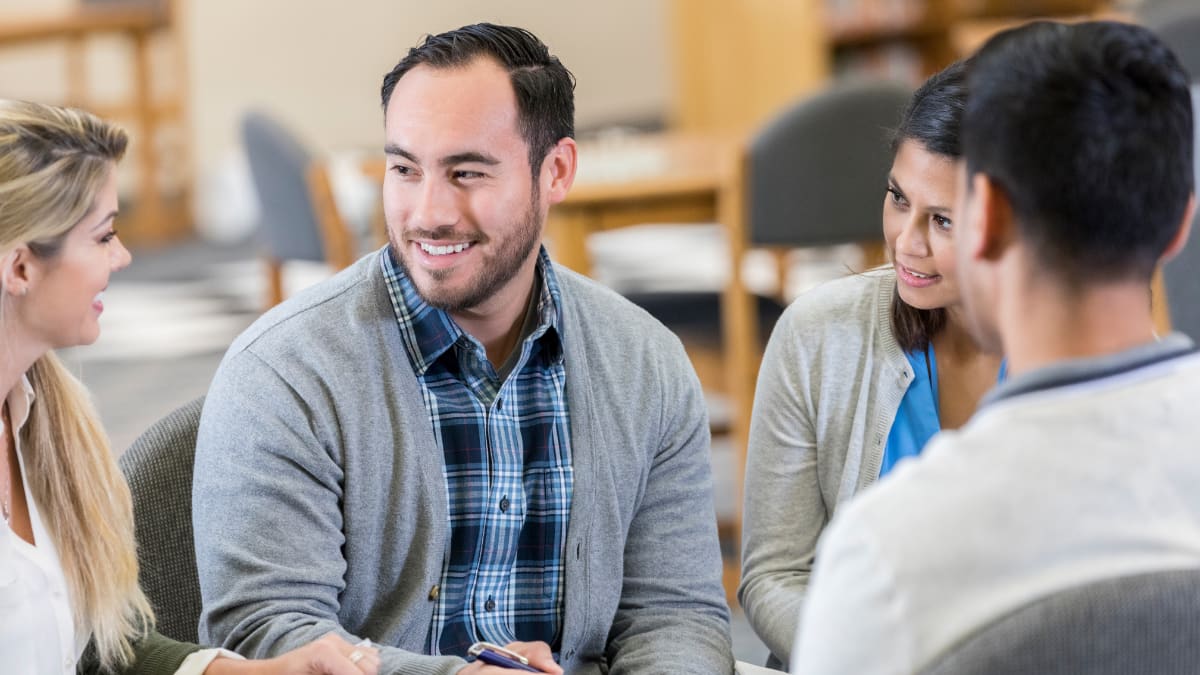 Counselor working with group of young adults